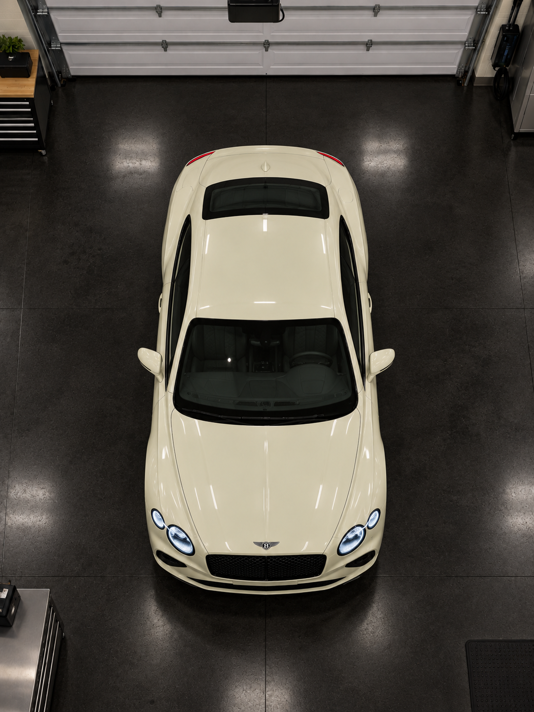 Clean ivory Bentley viewed from above in a garage